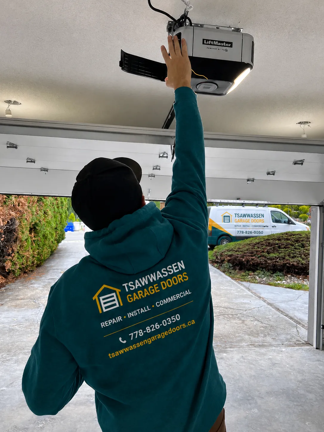 Tsawwassen Garage Doors technician installing a LiftMaster opener at a home
